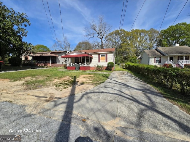 1243 Hill St NW, Conyers, GA 30012 - view of front of home featuring a porch and driveway