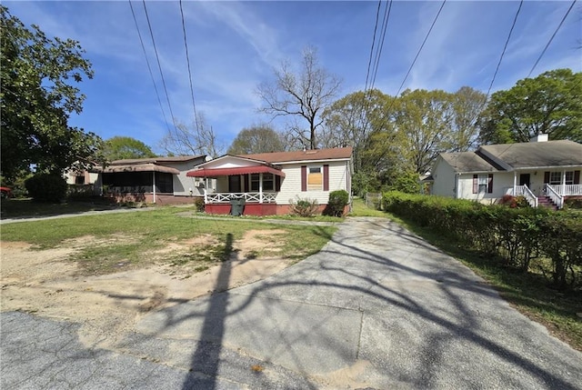 1243 Hill St NW, Conyers, GA 30012 - view of front of home featuring a porch