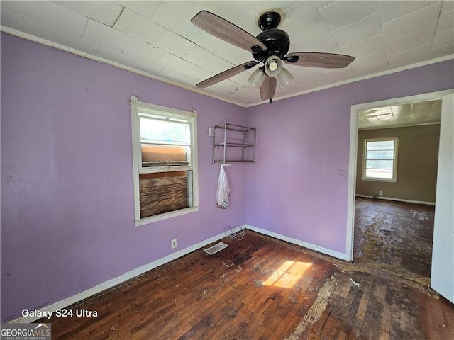 1243 Hill St NW, Conyers, GA 30012 - empty room featuring crown molding, baseboards, hardwood / wood-style flooring, and ceiling fan