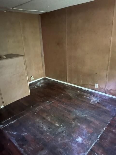 spare room with wood-type flooring