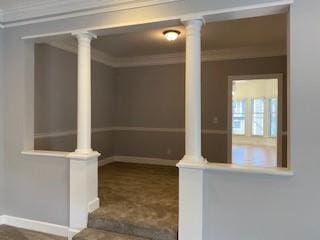 basement featuring baseboards and crown molding