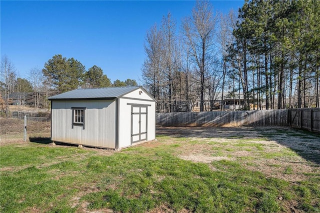 view of outbuilding featuring a lawn