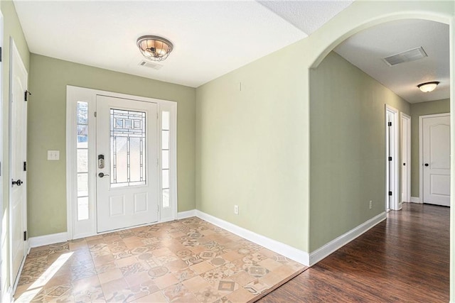 foyer featuring a textured ceiling and hardwood / wood-style flooring