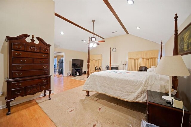 bedroom with light hardwood / wood-style floors and vaulted ceiling