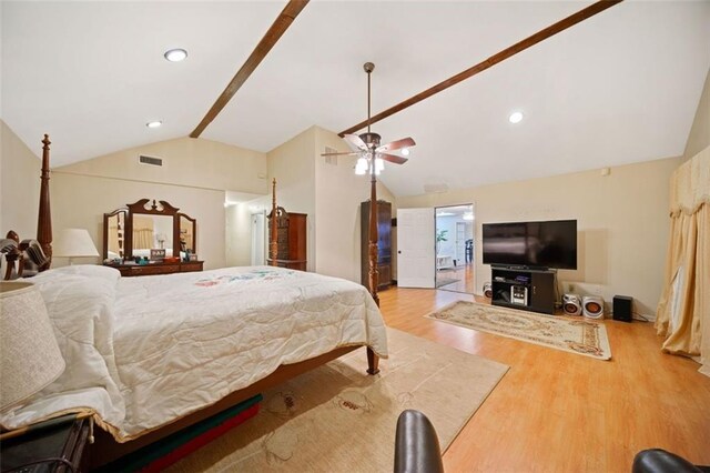 bedroom featuring ceiling fan, vaulted ceiling, and light hardwood / wood-style flooring