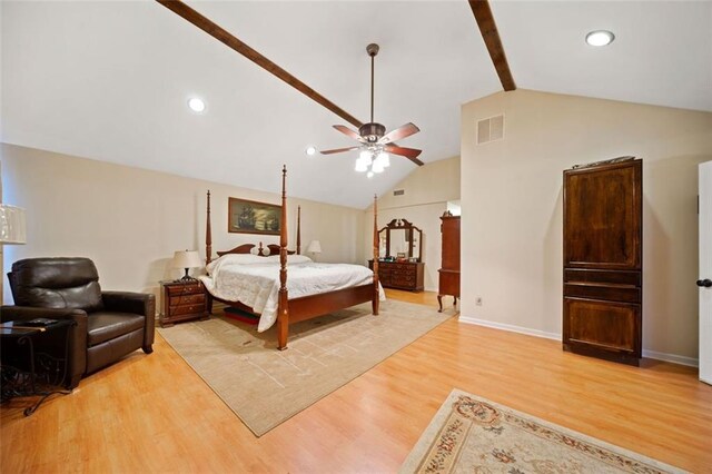 bedroom with vaulted ceiling with beams, ceiling fan, and light hardwood / wood-style floors