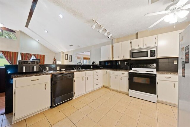 kitchen featuring white cabinets, vaulted ceiling, white appliances, decorative backsplash, and light tile patterned floors