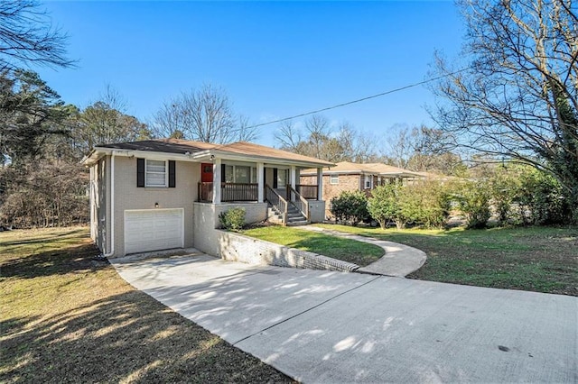 single story home with a porch, a garage, and a front lawn