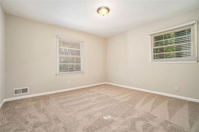 view of carpeted spare room