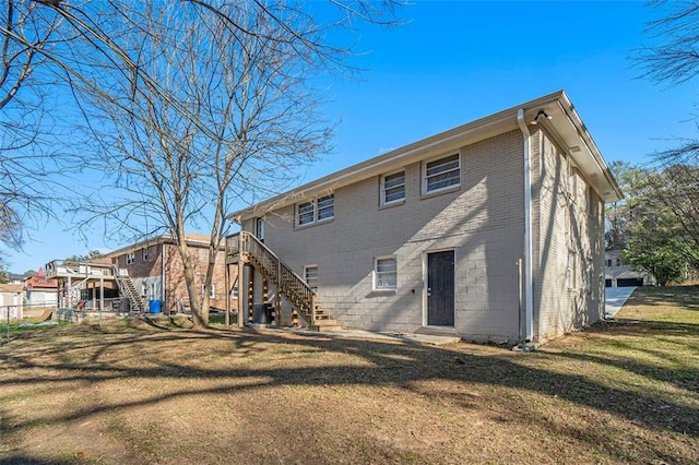 back of house with a yard