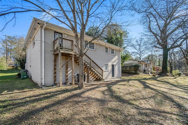 rear view of house with a lawn