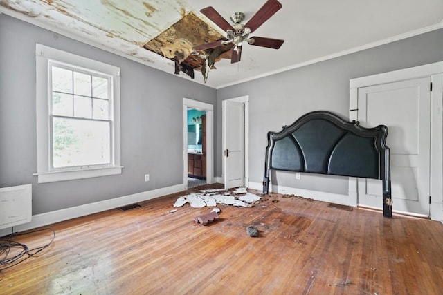 10 Shadburn Ferry Rd, Buford, GA 30518 - unfurnished bedroom featuring wood-type flooring, crown molding, and ensuite bath