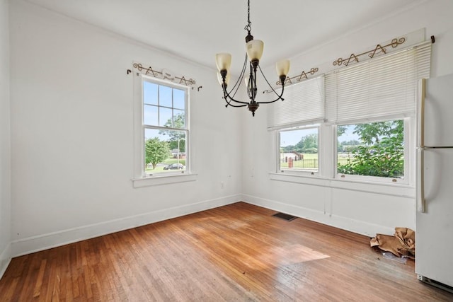 10 Shadburn Ferry Rd, Buford, GA 30518 - unfurnished dining area featuring a chandelier, light wood-style floors, and ornamental molding