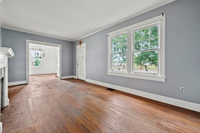 10 Shadburn Ferry Rd, Buford, GA 30518 - unfurnished living room with a chandelier, crown molding, plenty of natural light, hardwood / wood-style floors, and a fireplace