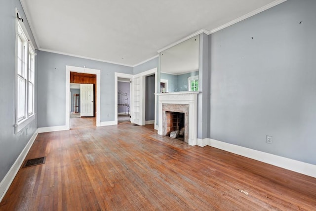 10 Shadburn Ferry Rd, Buford, GA 30518 - unfurnished living room featuring ornamental molding, a fireplace, and wood finished floors