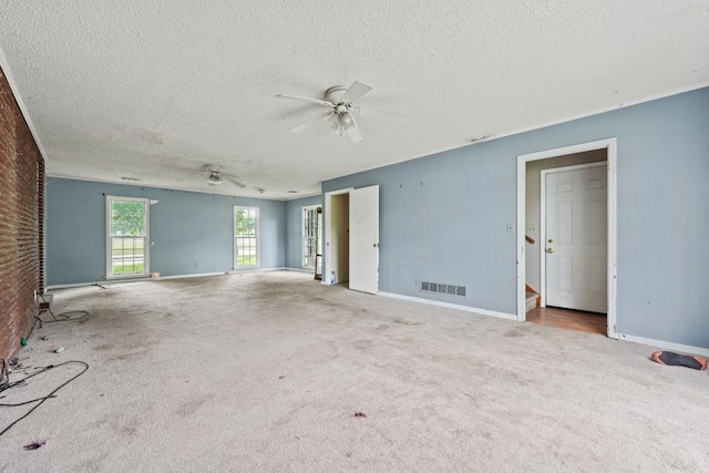 10 Shadburn Ferry Rd, Buford, GA 30518 - unfurnished living room featuring carpet flooring, a ceiling fan, and a textured ceiling