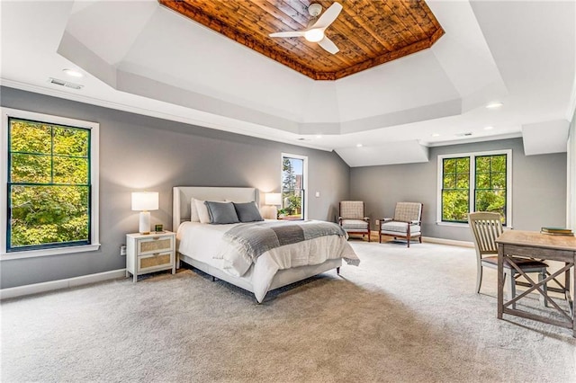 carpeted bedroom with recessed lighting, a raised ceiling, visible vents, and baseboards