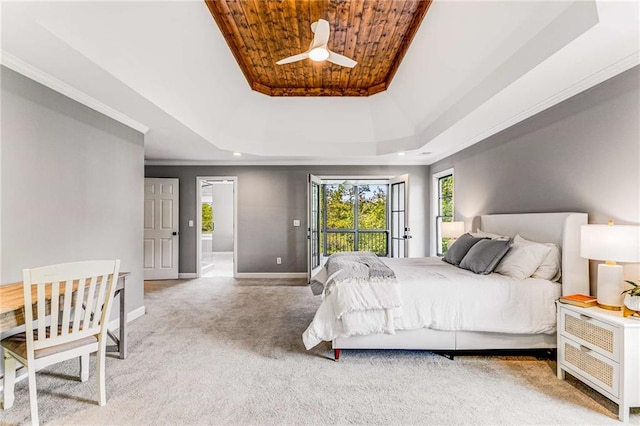 bedroom with baseboards, a raised ceiling, wood ceiling, crown molding, and carpet floors