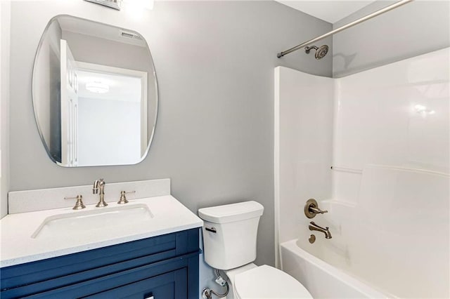 bathroom with toilet, washtub / shower combination, and vanity