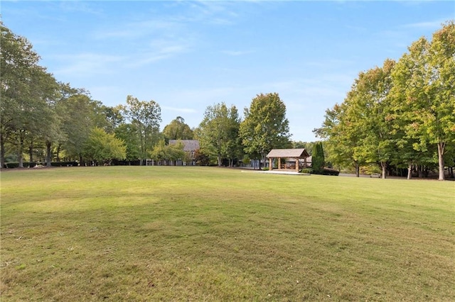 view of home's community with a lawn and a gazebo