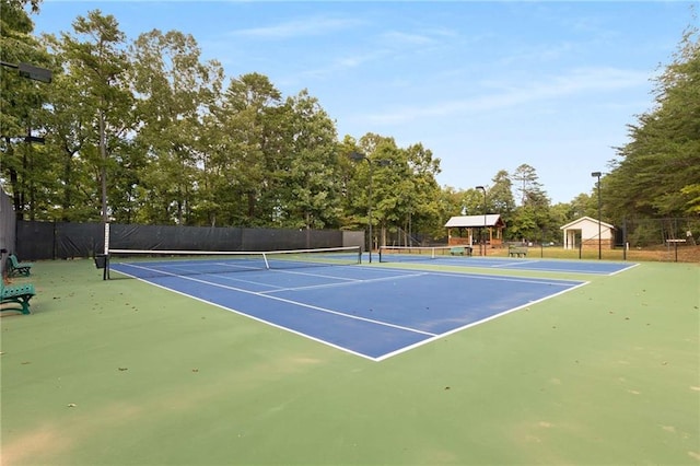 view of tennis court with fence