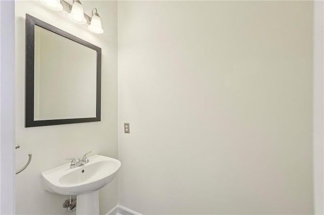 711 Cosmopolitan Dr NE Unit 802, Atlanta, GA 30324 - bathroom featuring baseboards and a sink