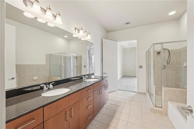 711 Cosmopolitan Dr NE Unit 802, Atlanta, GA 30324 - bathroom featuring tile patterned flooring, a stall shower, double vanity, and a bath
