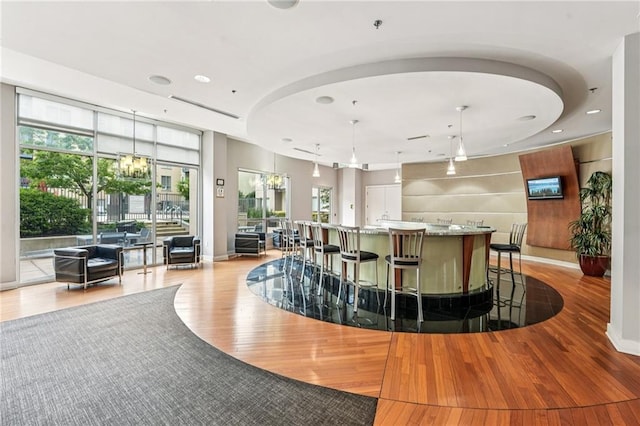 711 Cosmopolitan Dr NE Unit 802, Atlanta, GA 30324 - bar featuring light wood-style floors, decorative light fixtures, recessed lighting, and a chandelier