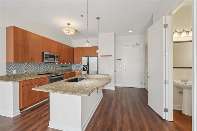 711 Cosmopolitan Dr NE Unit 802, Atlanta, GA 30324 - kitchen with appliances with stainless steel finishes, brown cabinets, and dark wood finished floors