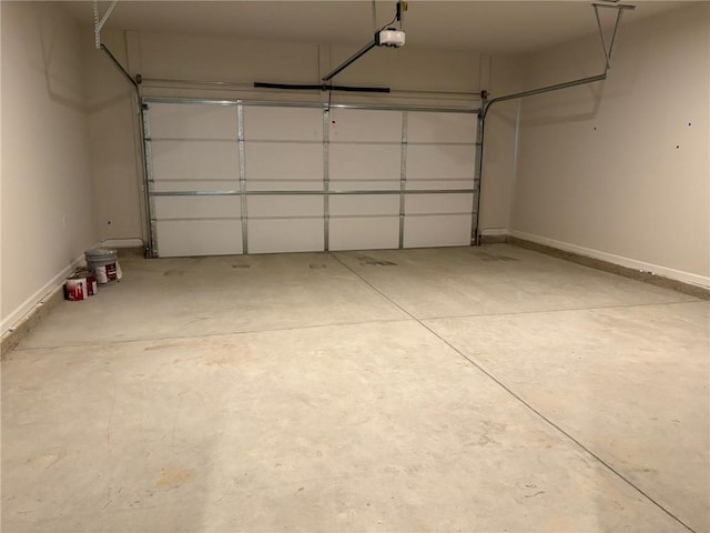 garage featuring baseboards and a garage door opener