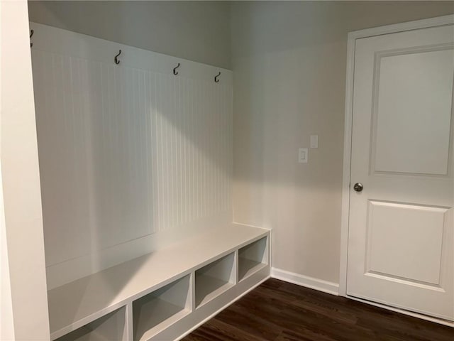 mudroom with baseboards and dark wood finished floors