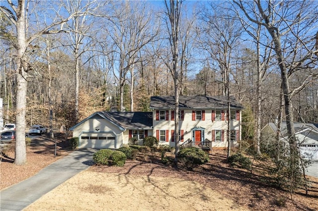 colonial-style house featuring a garage