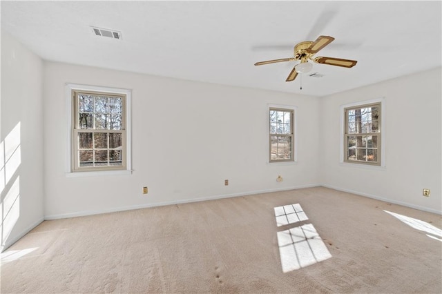 unfurnished room with light carpet and ceiling fan