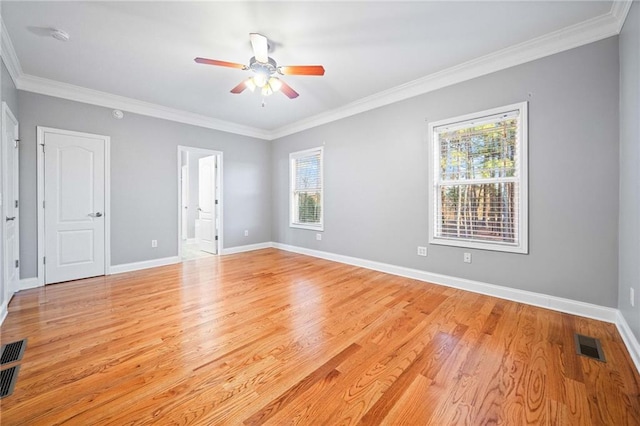 spare room featuring ornamental molding, ceiling fan, and light hardwood / wood-style flooring