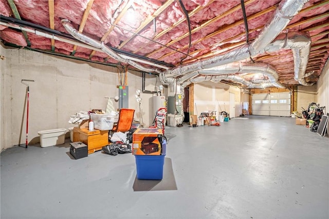 basement featuring water heater, heating unit, and electric panel