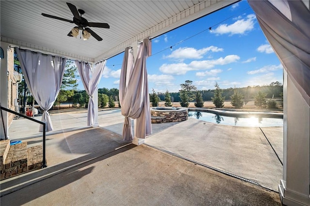 view of patio with a pool with hot tub and ceiling fan