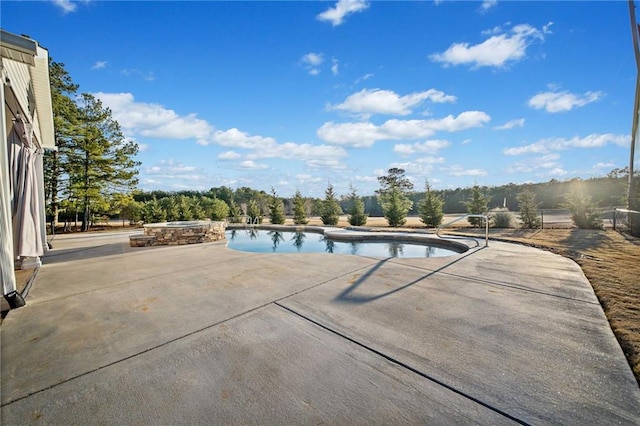 view of pool featuring a patio area