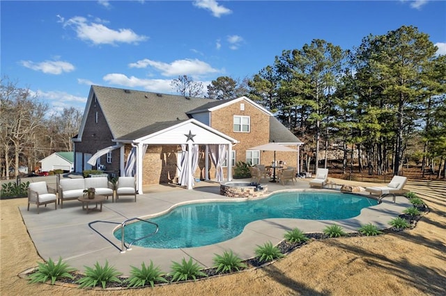 back of property with an outdoor hangout area and a patio area