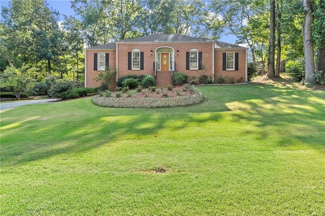 single story home with a front lawn