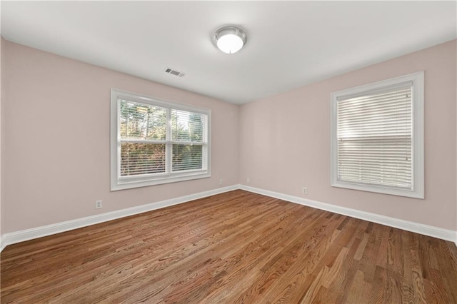 empty room with wood-type flooring