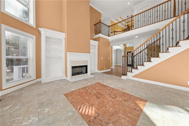 living room with a towering ceiling