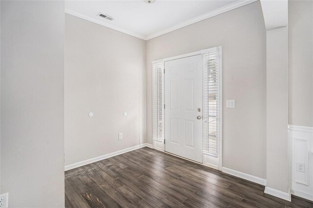 entryway featuring dark wood-style floors, visible vents, crown molding, and baseboards