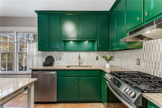 kitchen featuring under cabinet range hood, backsplash, stainless steel appliances, and a sink