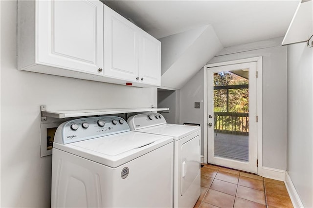 laundry area with baseboards, cabinet space, washing machine and clothes dryer, and light tile patterned floors