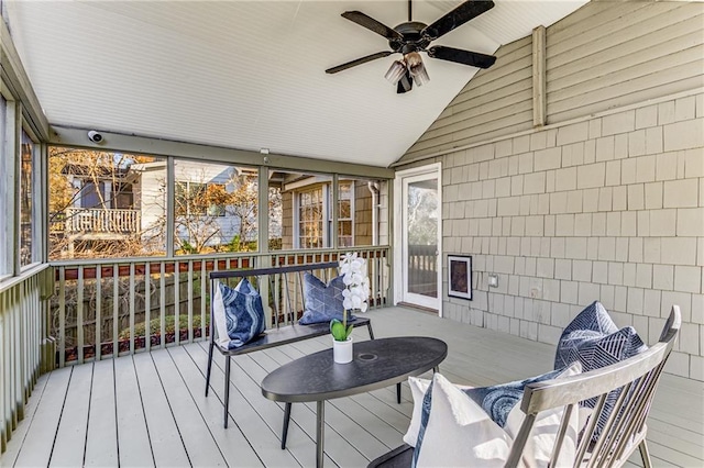 wooden terrace with a ceiling fan