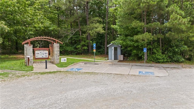 3517 Plunkett Rd, Stonecrest, GA 30038 - uncovered parking lot featuring a shed