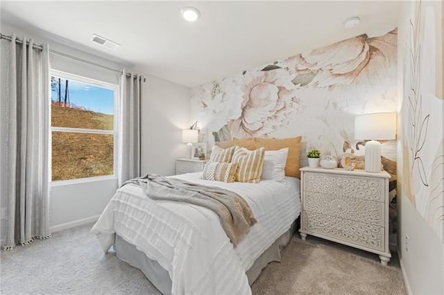 bedroom featuring baseboards, visible vents, and carpet floors