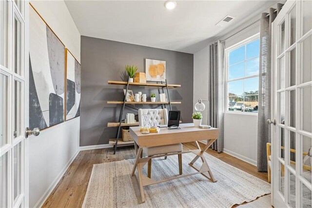 living room with light hardwood / wood-style flooring