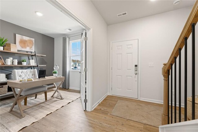 entrance foyer featuring light hardwood / wood-style floors