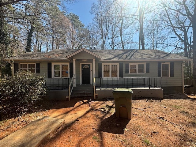 single story home with a porch